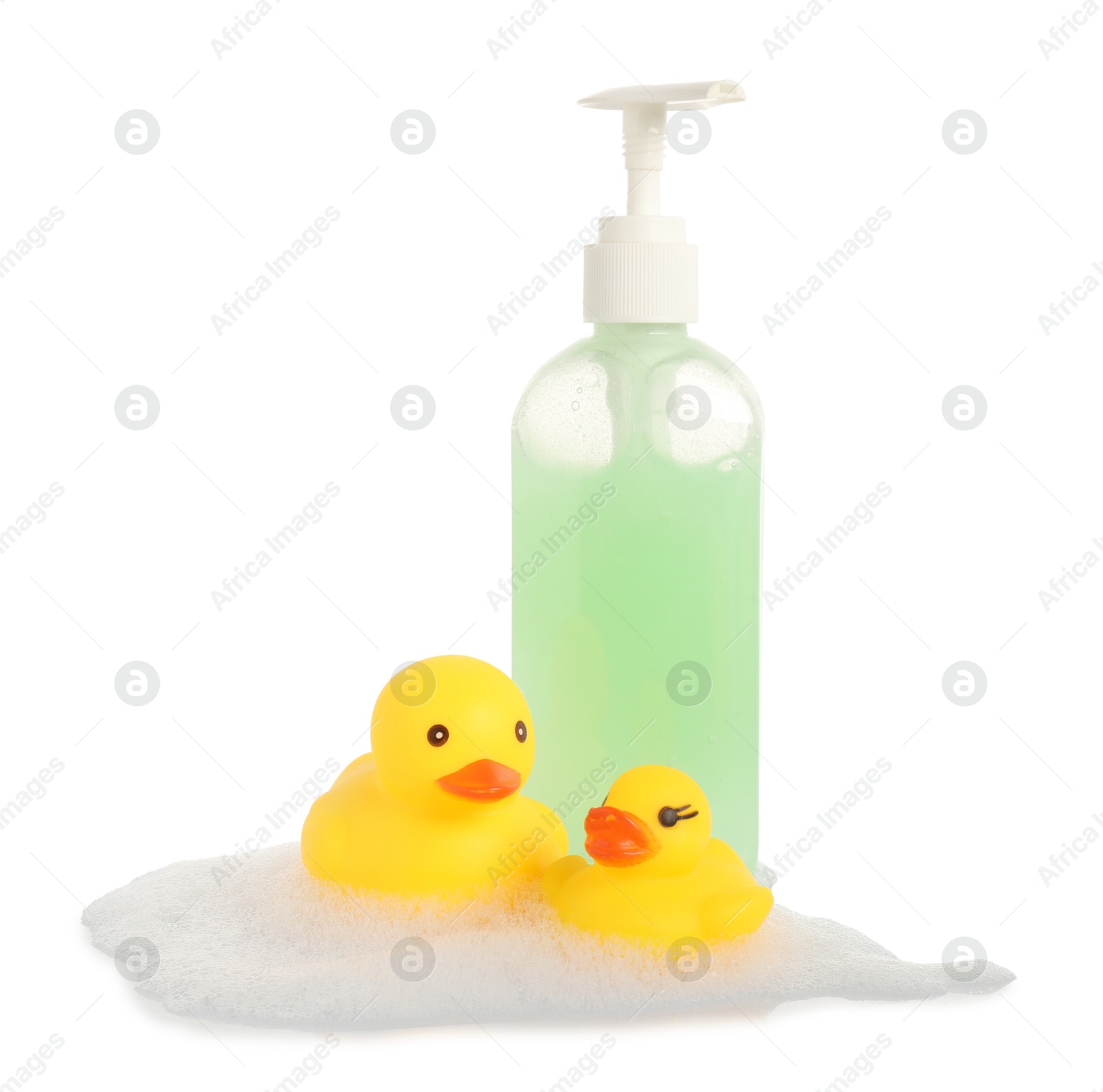 Cute rubber ducks, bottle of bath products and foam isolated on white Photo of Cute rubber ducks, bottle of bath products and foam isolated on white