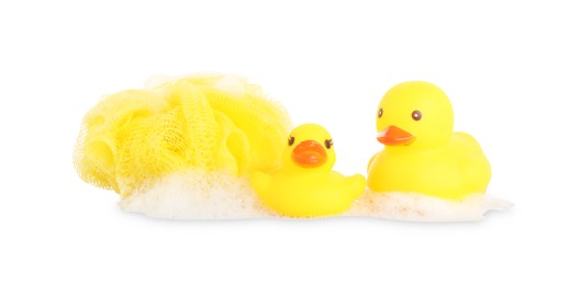 Photo of Cute rubber ducks, shower puff and foam isolated on white