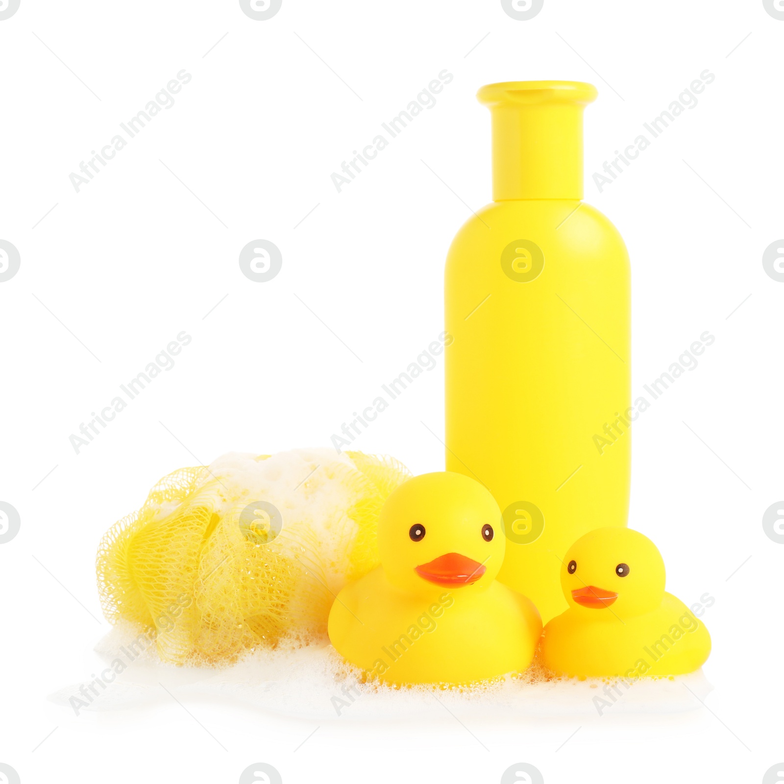 Cute rubber ducks, bottle of bath product, shower puff and foam isolated on white Photo of Cute rubber ducks, bottle of bath product, shower puff and foam isolated on white