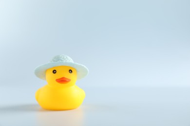 Photo of One cute rubber duck in hat on white background, space for text
