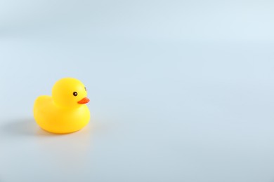 Photo of One cute rubber duck on white background, space for text