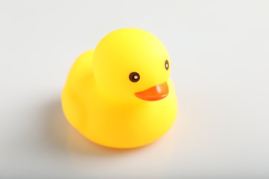 Photo of One cute rubber duck on white background, closeup