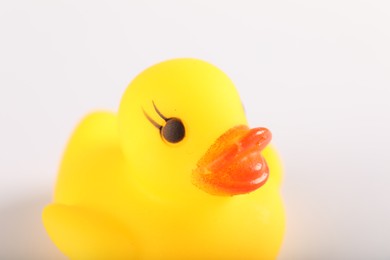 Photo of One cute rubber duck on white background, closeup