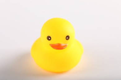 Photo of One cute rubber duck on white background, closeup