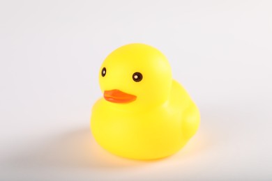 Photo of One cute rubber duck on white background, closeup