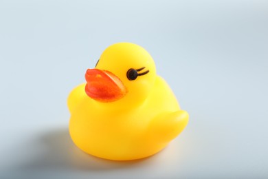 Photo of One cute rubber duck on white background, closeup