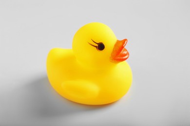 Photo of One cute rubber duck on white background, closeup