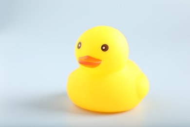 Photo of One cute rubber duck on white background, closeup