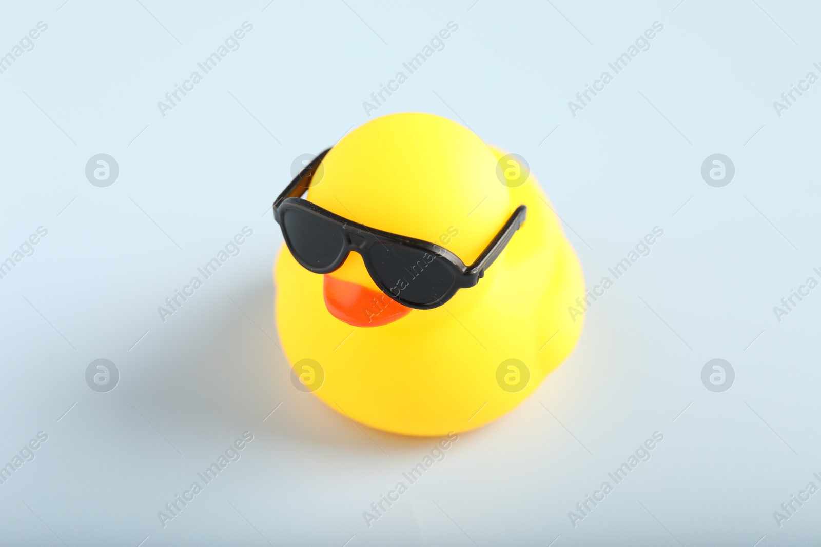 Cute rubber duck with sunglasses on white background, closeup Photo of Cute rubber duck with sunglasses on white background, closeup