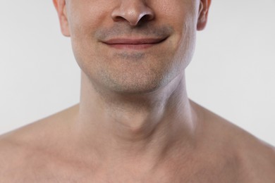 Photo of Man after shaving on white background, closeup