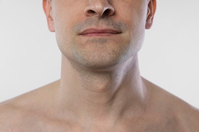 Photo of Man after shaving on white background, closeup