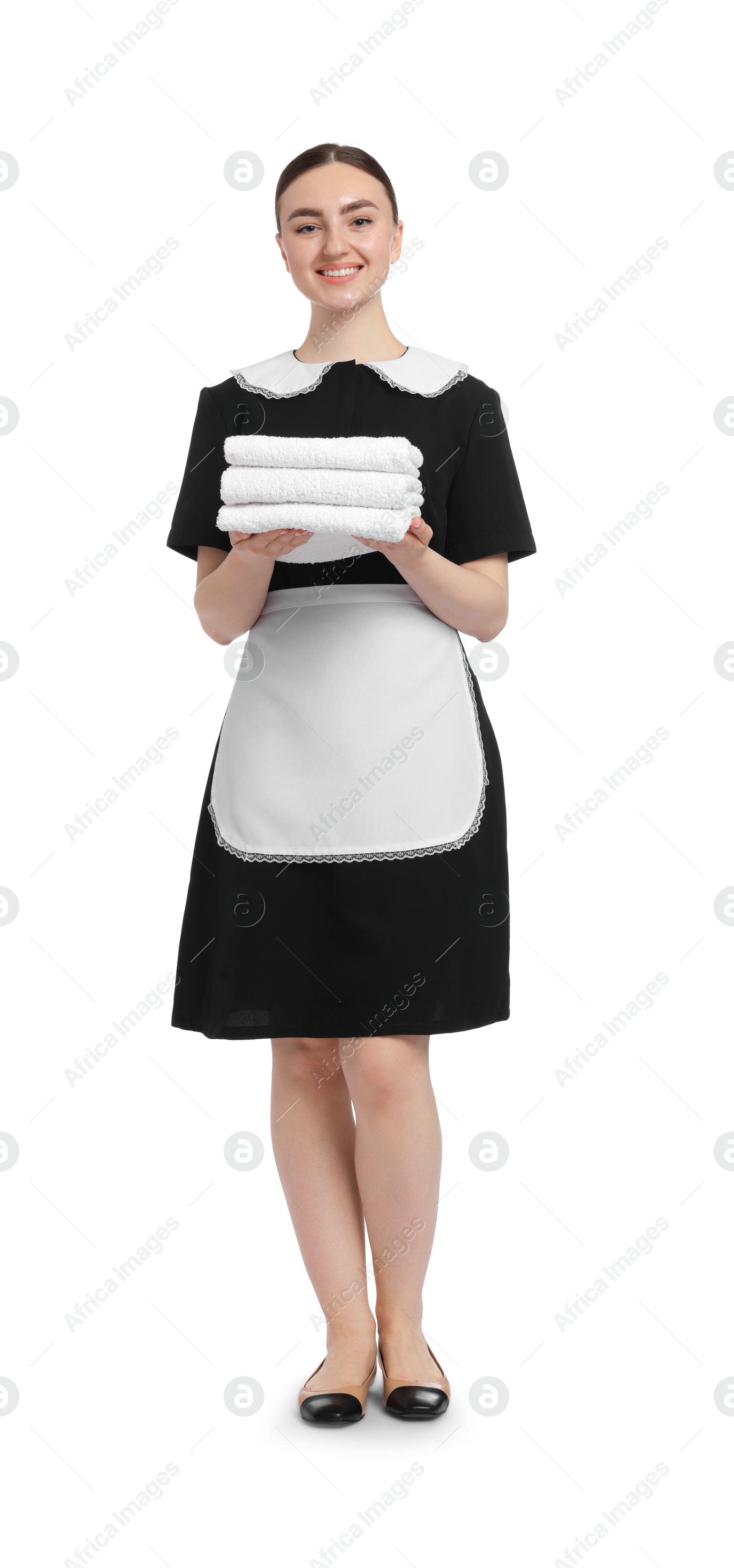Chambermaid with stack of clean towels on white background Photo of Chambermaid with stack of clean towels on white background