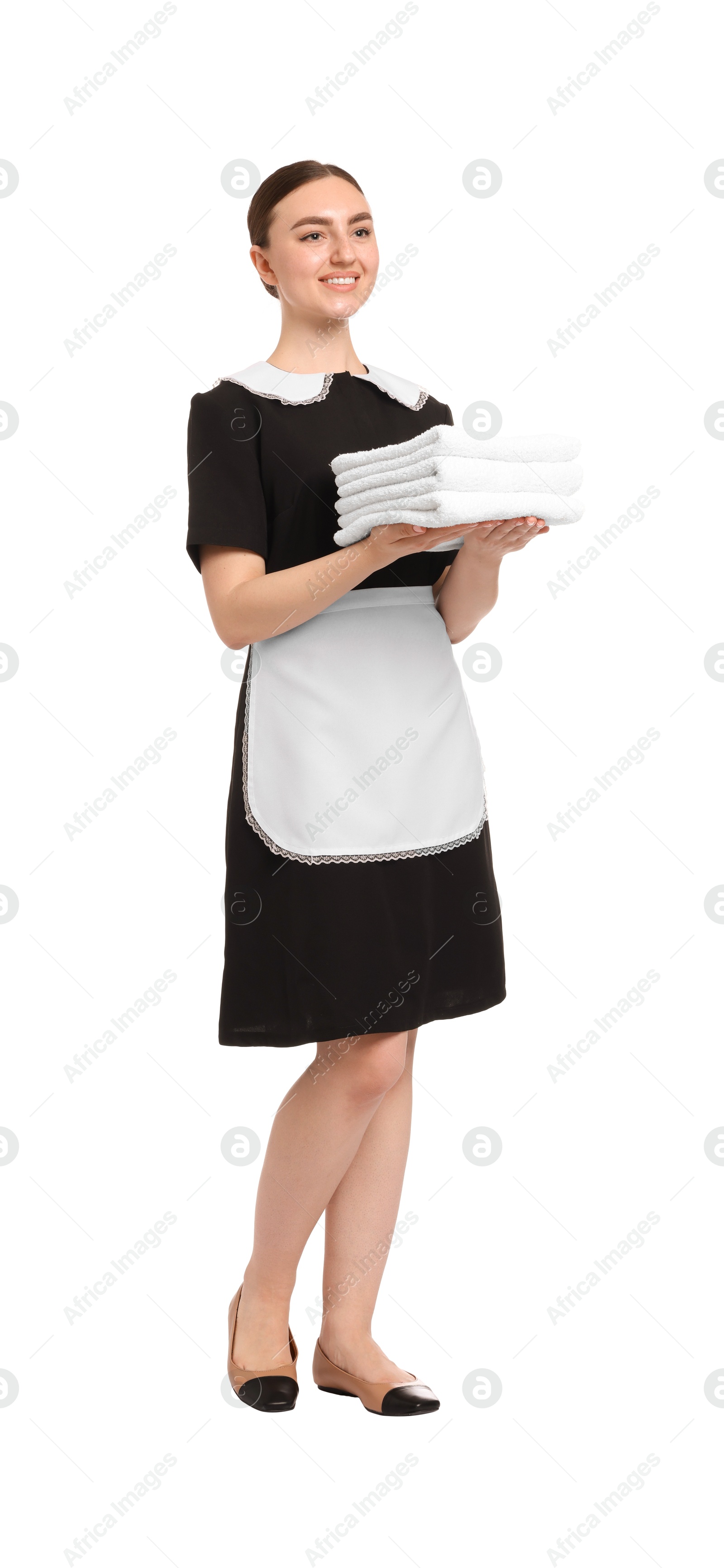 Chambermaid with stack of clean towels on white background Photo of Chambermaid with stack of clean towels on white background