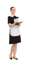 Photo of Chambermaid with stack of clean towels on white background