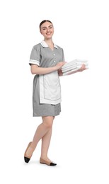 Photo of Chambermaid with stack of clean towels on white background