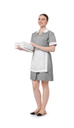 Photo of Chambermaid with stack of clean towels on white background