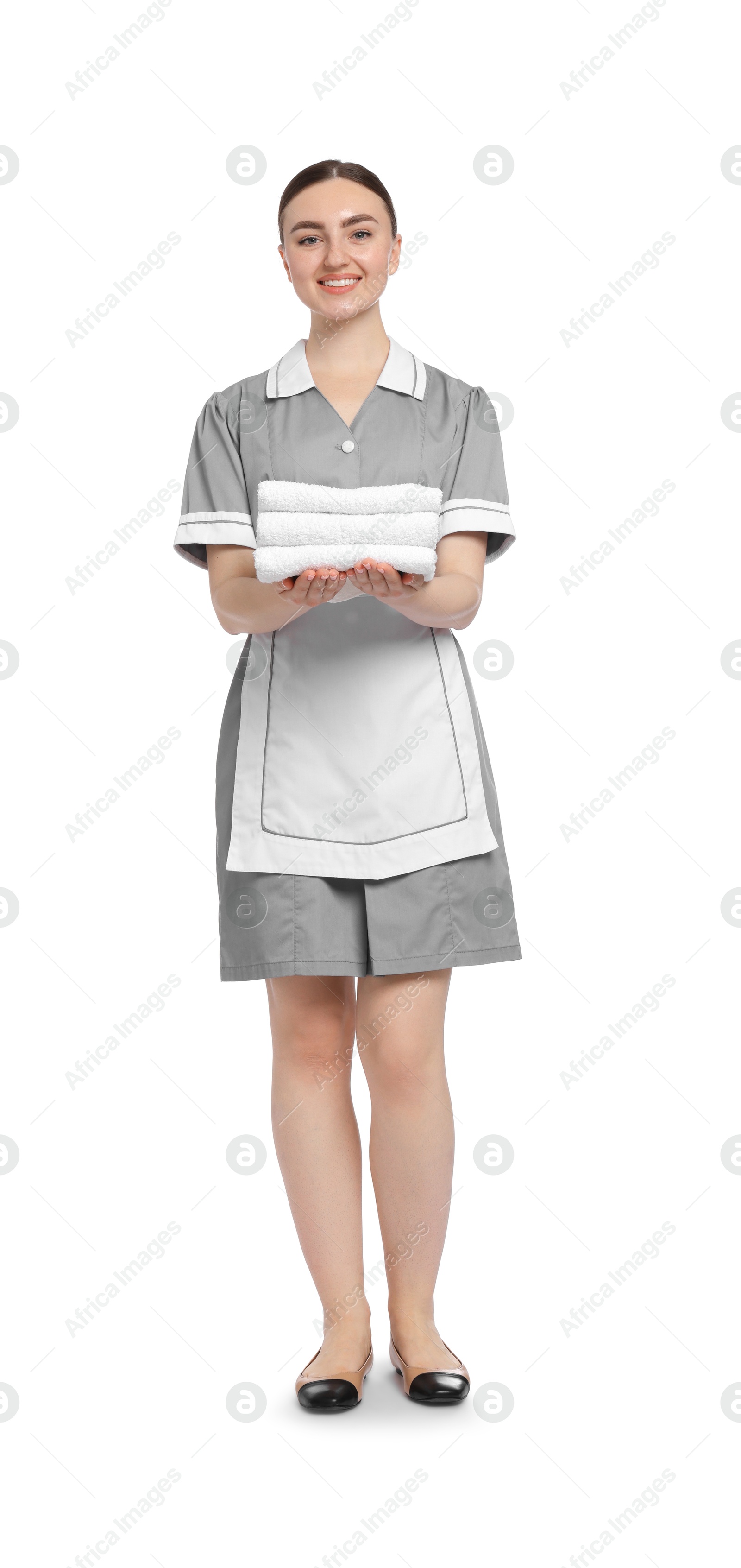 Photo of Chambermaid with stack of clean towels on white background