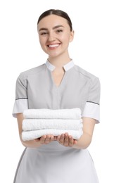 Photo of Chambermaid with stack of clean towels on white background