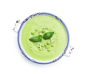 Photo of Tasty pea cream soup with basil isolated on white, top view