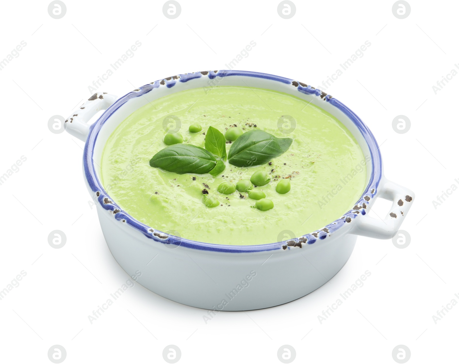 Tasty pea cream soup with basil isolated on white Photo of Tasty pea cream soup with basil isolated on white