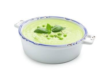 Photo of Tasty pea cream soup with basil isolated on white