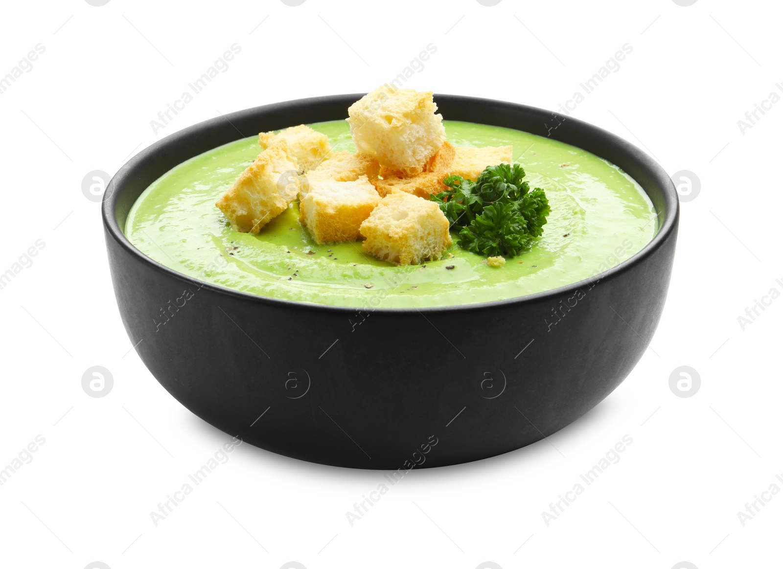 Tasty pea cream soup with croutons and broccoli isolated on white Photo of Tasty pea cream soup with croutons and broccoli isolated on white