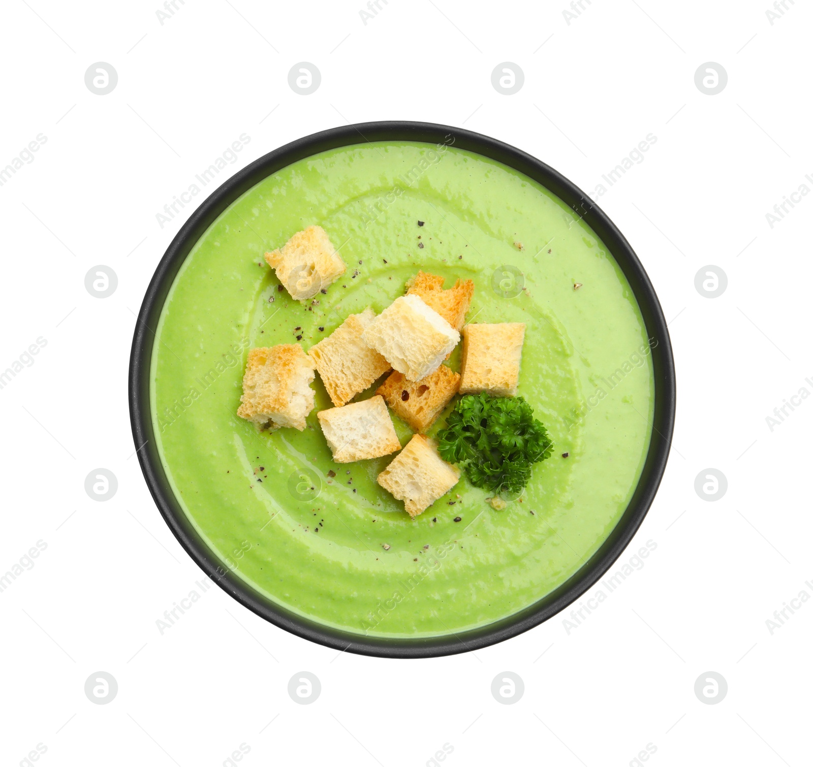 Tasty pea cream soup with croutons and broccoli isolated on white, top view Photo of Tasty pea cream soup with croutons and broccoli isolated on white, top view