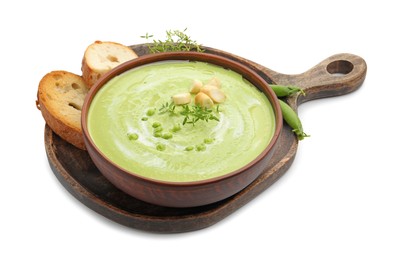 Photo of Tasty pea cream soup with croutons and thyme isolated on white