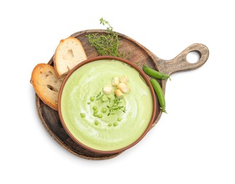 Photo of Tasty pea cream soup with croutons and thyme isolated on white