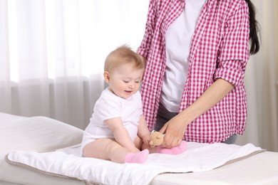 Photo of Mother and her cute baby in clinic