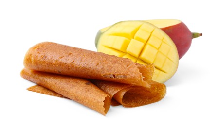 Photo of Delicious fruit leather rolls and mango isolated on white