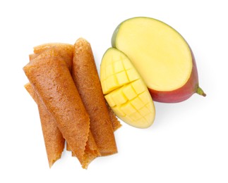 Photo of Delicious fruit leather rolls and mango isolated on white, top view