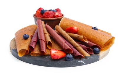 Photo of Delicious fruit leather rolls and berries isolated on white