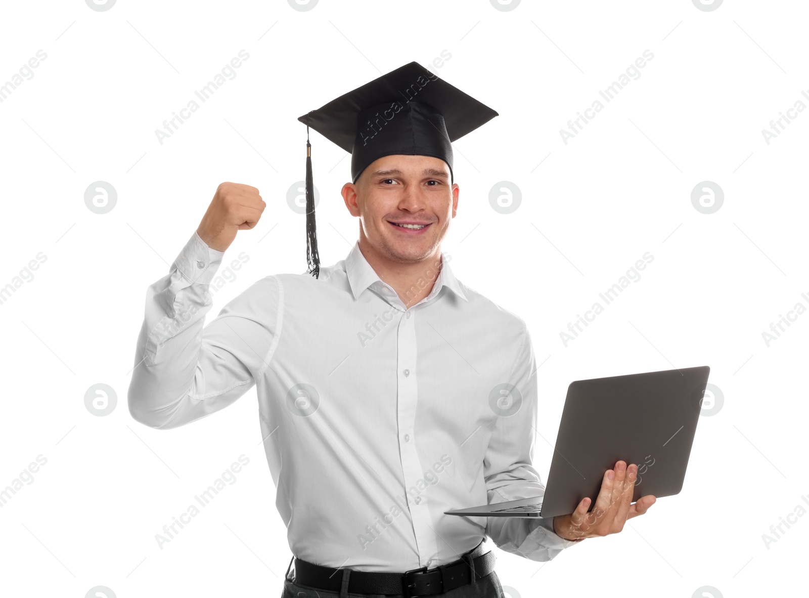 Happy student with laptop after graduation on white background Photo of Happy student with laptop after graduation on white background