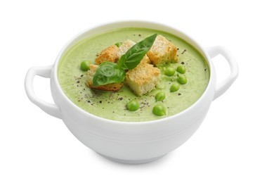 Photo of Tasty pea cream soup with croutons and basil isolated on white