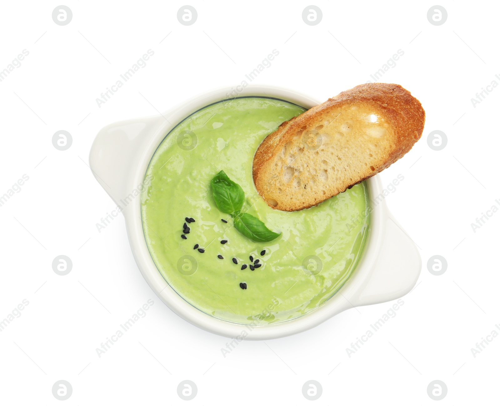 Tasty pea cream soup with basil and crouton isolated on white, top view Photo of Tasty pea cream soup with basil and crouton isolated on white, top view
