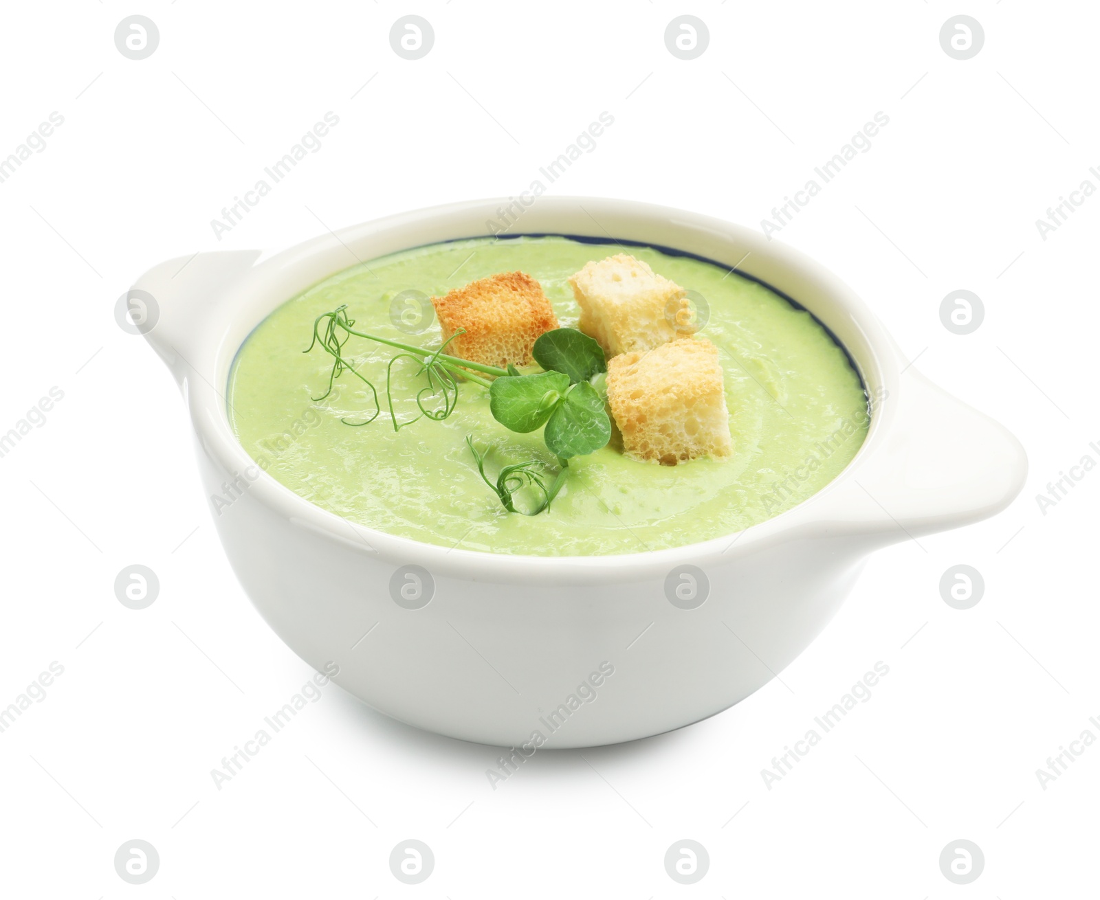 Tasty pea cream soup with croutons and microgreens isolated on white Photo of Tasty pea cream soup with croutons and microgreens isolated on white