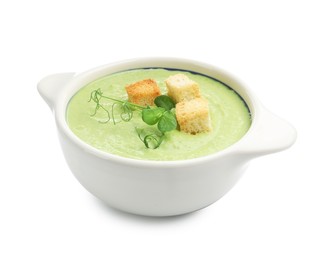 Photo of Tasty pea cream soup with croutons and microgreens isolated on white