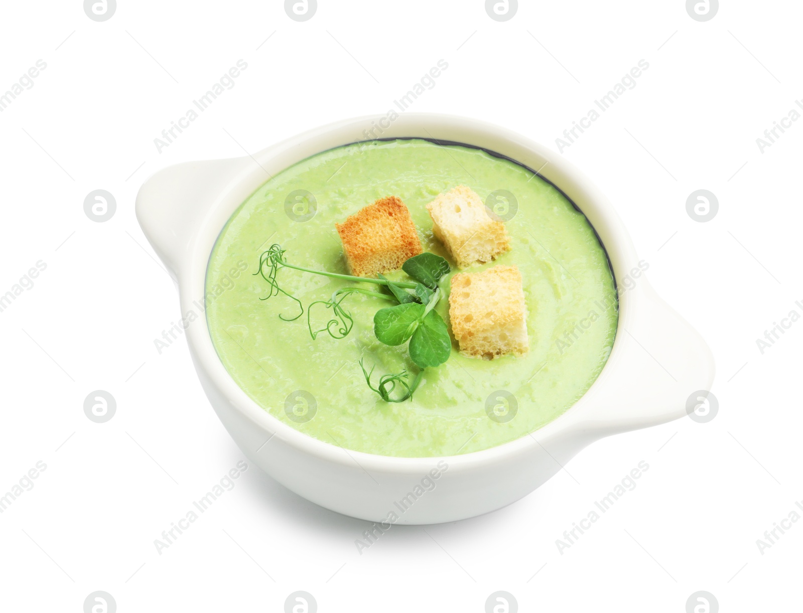 Tasty pea cream soup with croutons and microgreens isolated on white Photo of Tasty pea cream soup with croutons and microgreens isolated on white