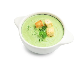 Photo of Tasty pea cream soup with croutons and microgreens isolated on white