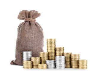 Image of Wealth. Stacked coins and burlap bag isolated on white