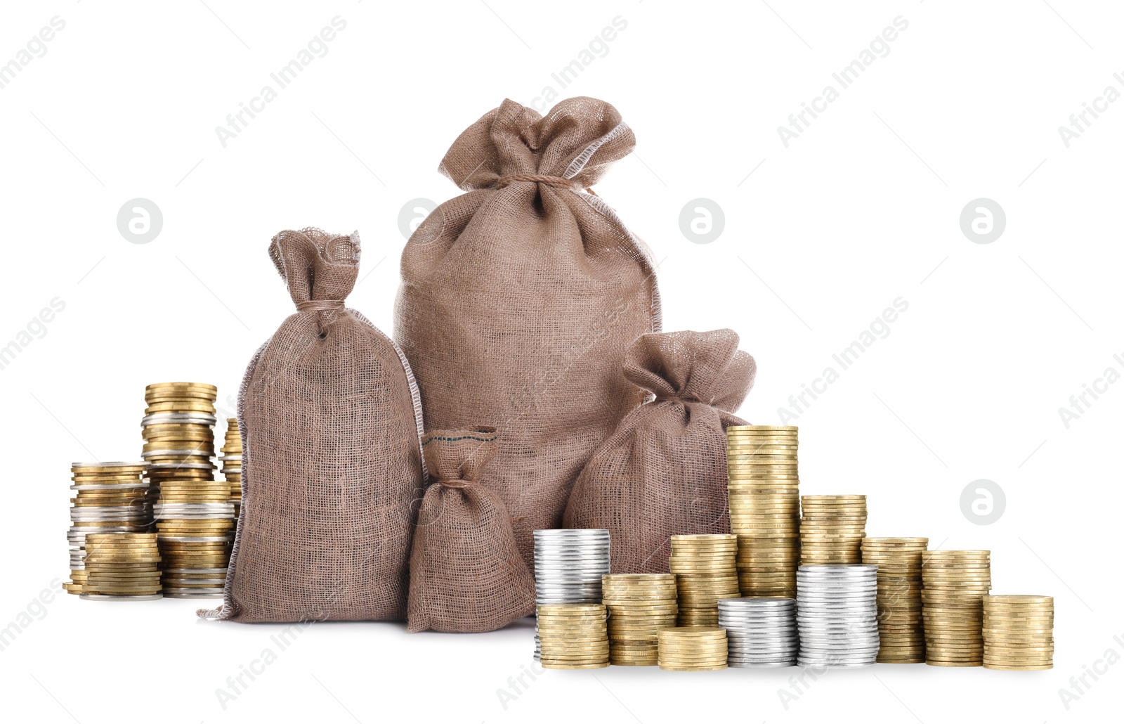 Wealth. Stacked coins and burlap bags isolated on white Image of Wealth. Stacked coins and burlap bags isolated on white