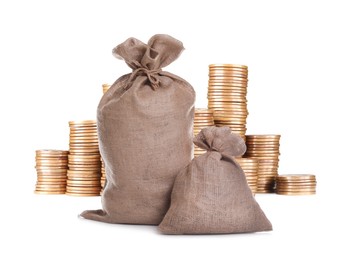 Image of Wealth. Stacked coins and burlap bags isolated on white