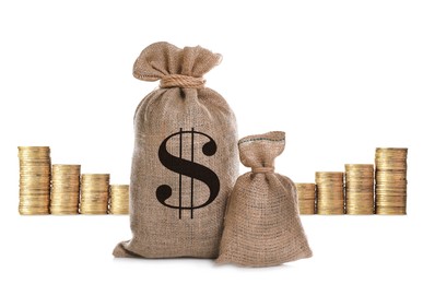 Image of Wealth. Burlap bags and stacked coins isolated on white