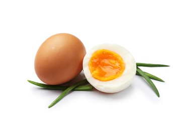 Photo of Soft boiled eggs with green onions isolated on white