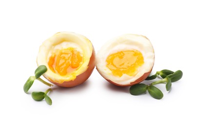 Photo of Soft boiled eggs with microgreens on white background