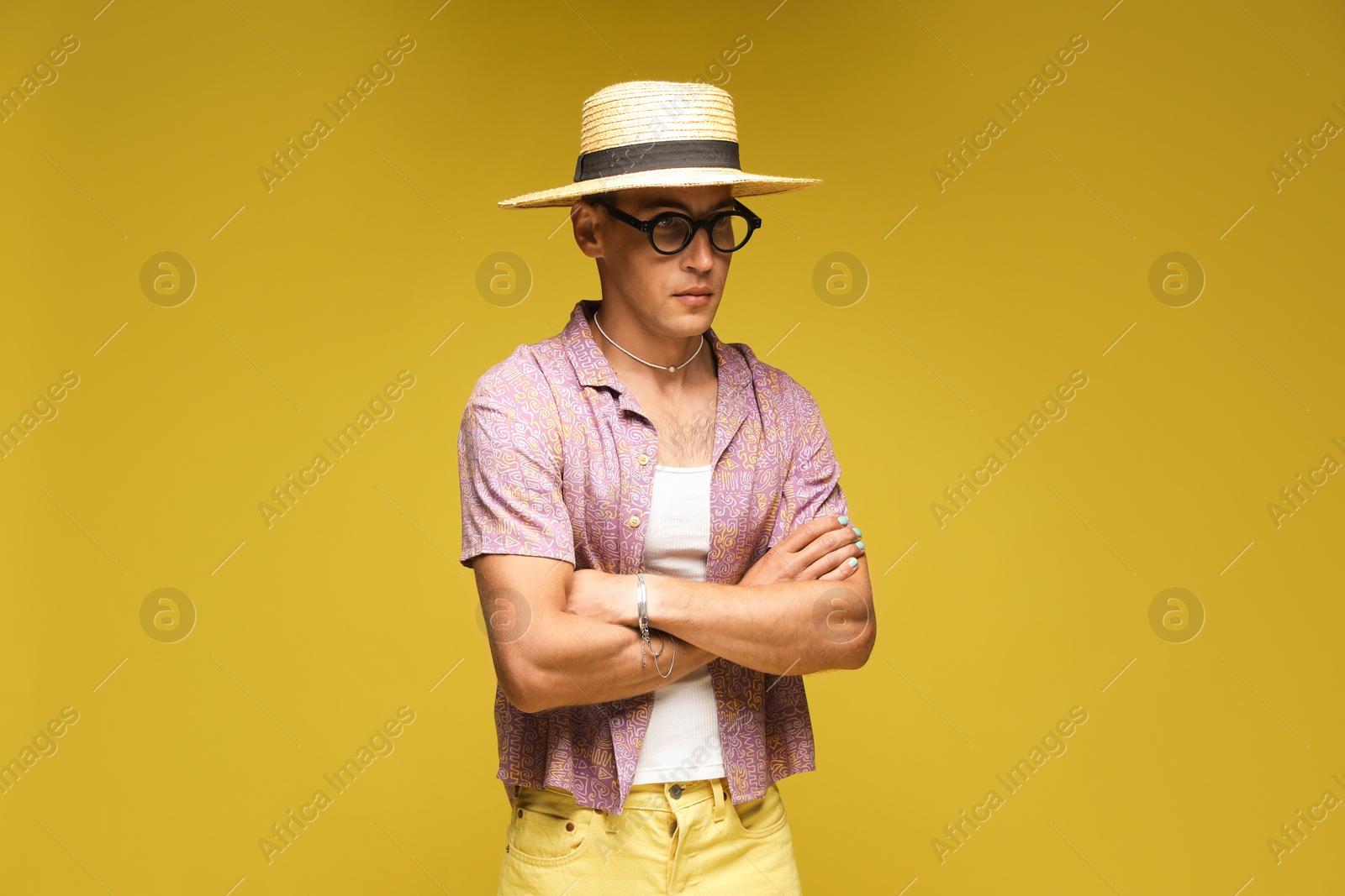 Fashionable portrait of handsome man in stylish outfit on color background Photo of Fashionable portrait of handsome man in stylish outfit on color background