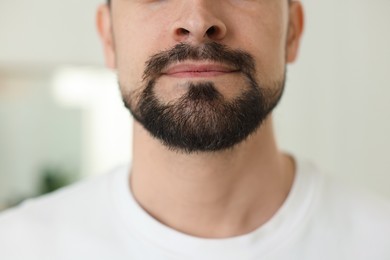 Photo of Man before shaving on blurred background, closeup