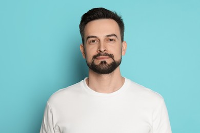 Photo of Handsome man before shaving on light blue background