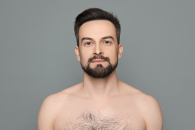 Photo of Handsome man before shaving on grey background